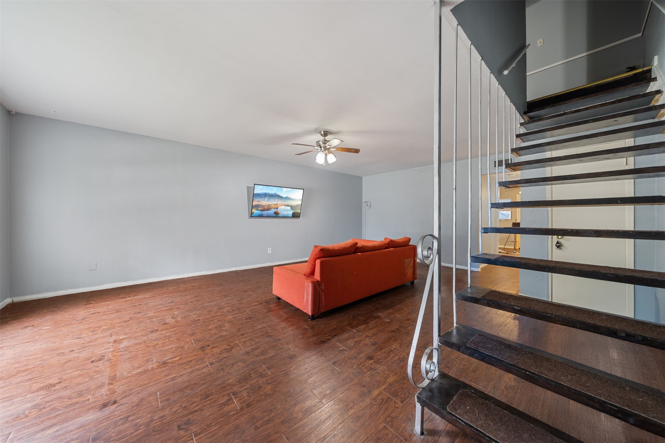 8216 Fondren Road, Unit 8216 Houston, TX 77074 - Photo 11 of 33 a view of a room with wooden floor and windows