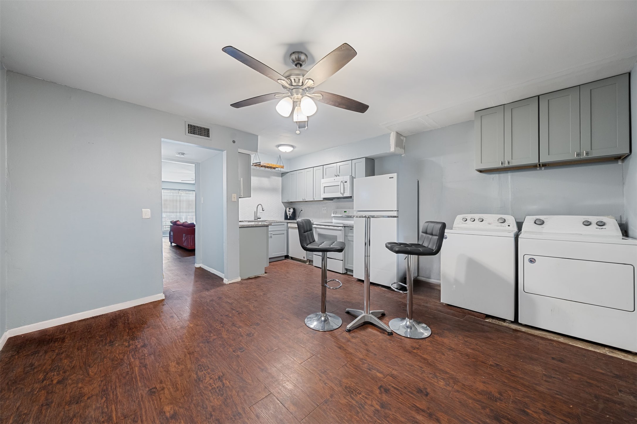 8216 Fondren Road, Unit 8216 Houston, TX 77074 - Photo 2 of 33 a view of kitchen with cabinets and wooden floor