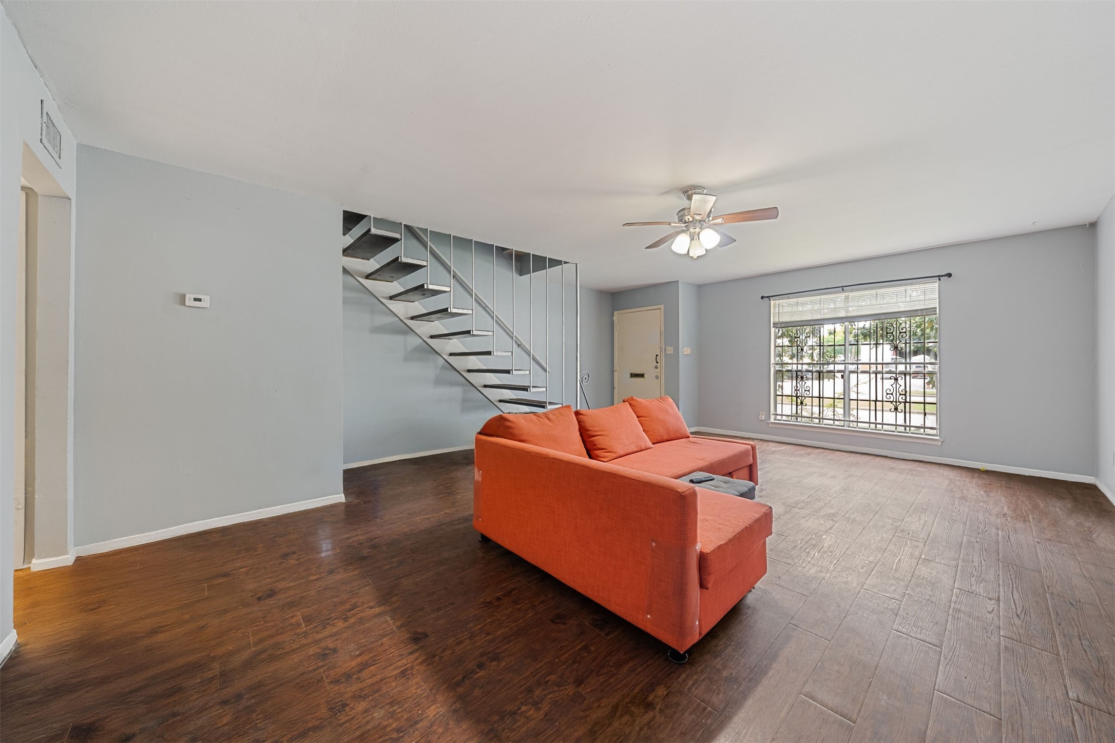 8216 Fondren Road, Unit 8216 Houston, TX 77074 - Photo 10 of 33 a living room with furniture and a window