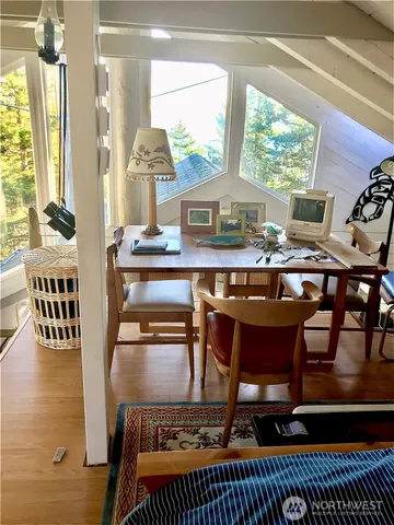 a dining room with furniture and window