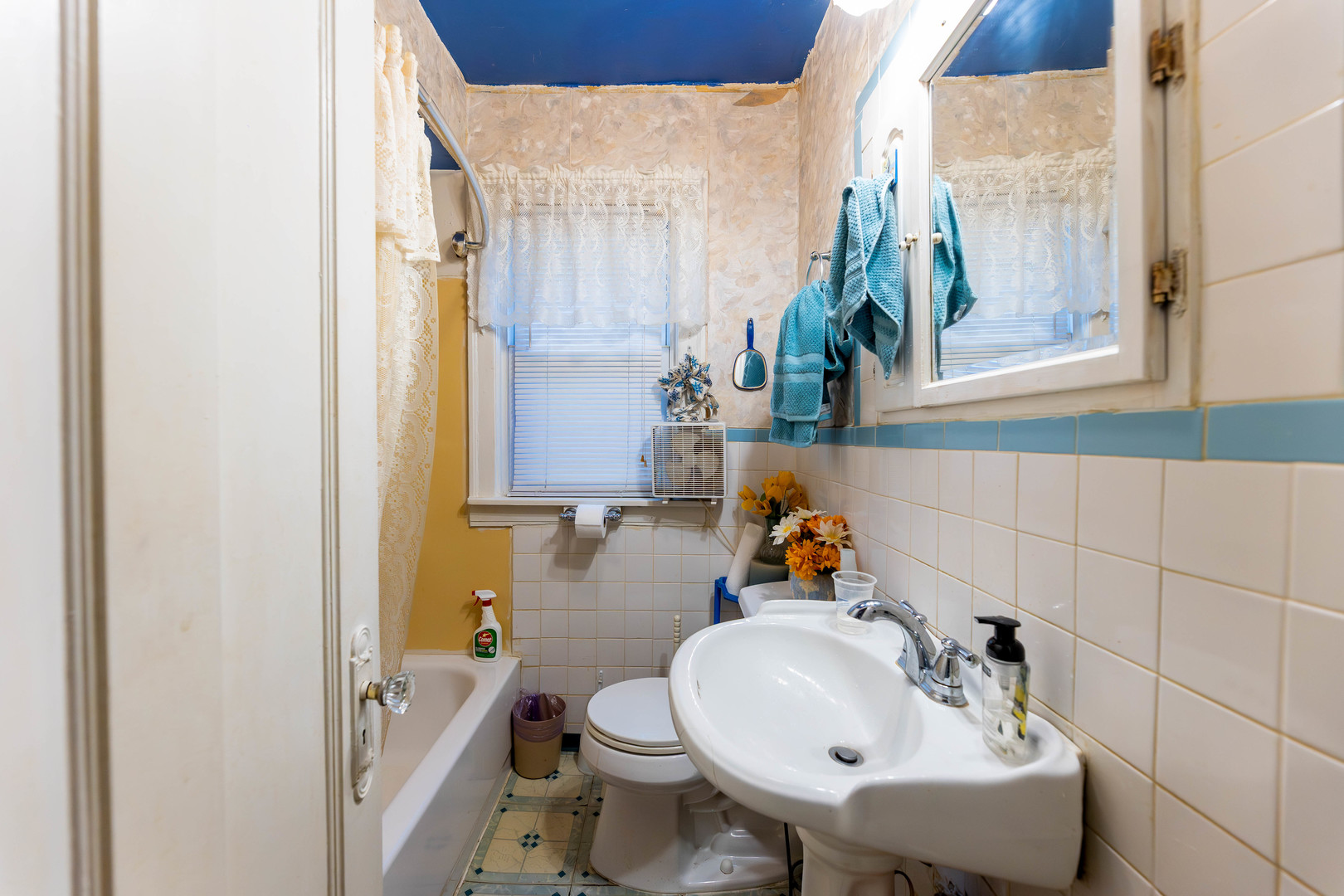 8129 South Cornell Avenue Chicago, IL 60617 - Photo 14 of 16 a bathroom with a sink and mirror with toilet