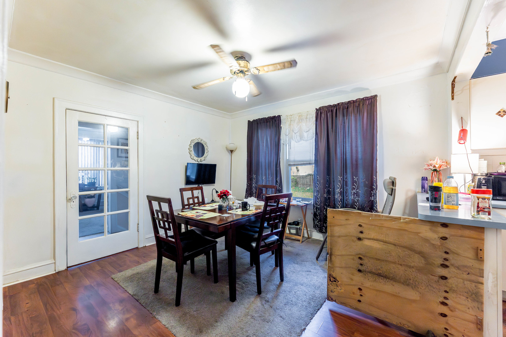 8129 South Cornell Avenue Chicago, IL 60617 - Photo 6 of 16 a view of a dining room with furniture and chandelier