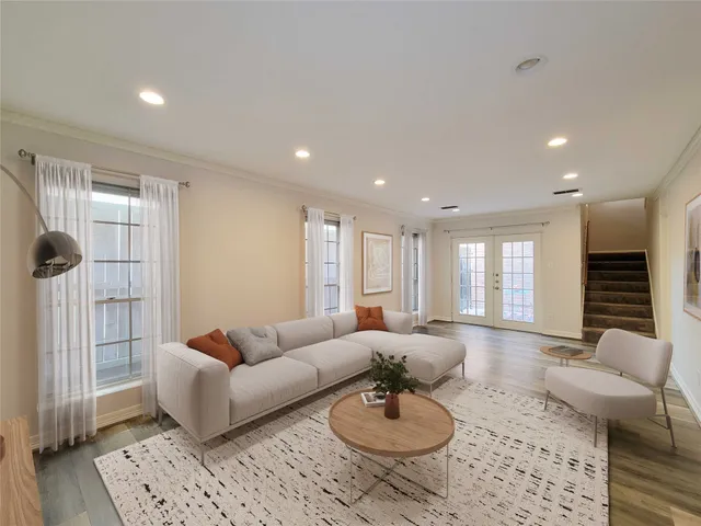 a living room with furniture and a rug