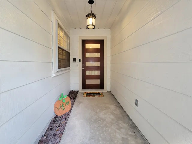 a view of an entryway with wooden floor