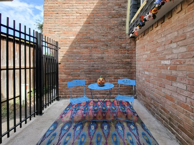a view of balcony with wooden floor