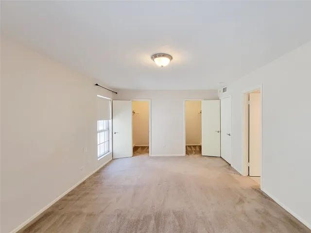 a view of empty room with windows