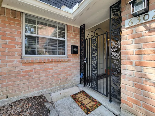 a view of a door and a window