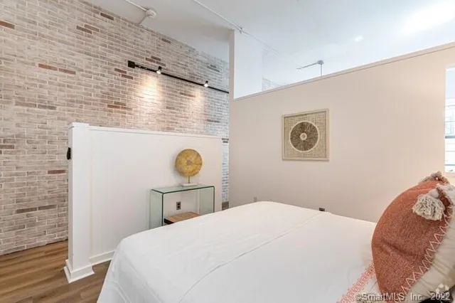 a bedroom with a bed and cabinets