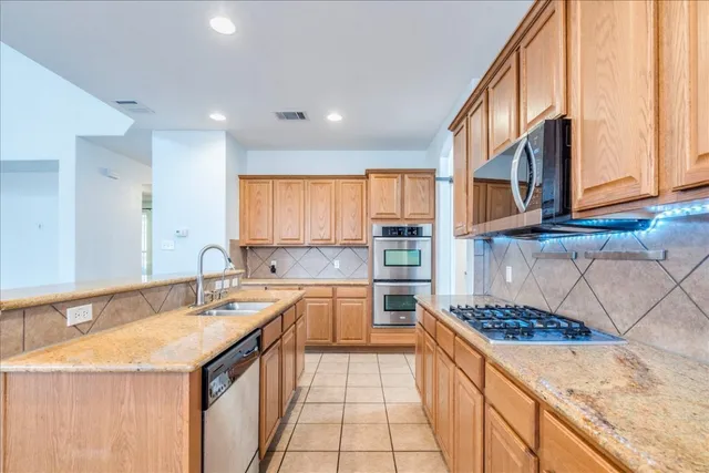 a bathroom with a sink double vanity and a bathtub