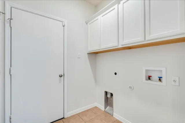 a view of a house with a yard and furniture