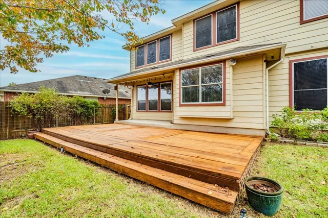 a swimming pool with wooden fence
