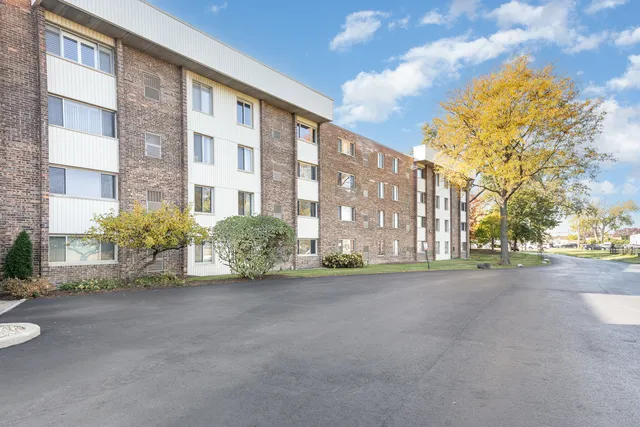 a view of a street with a building in the background