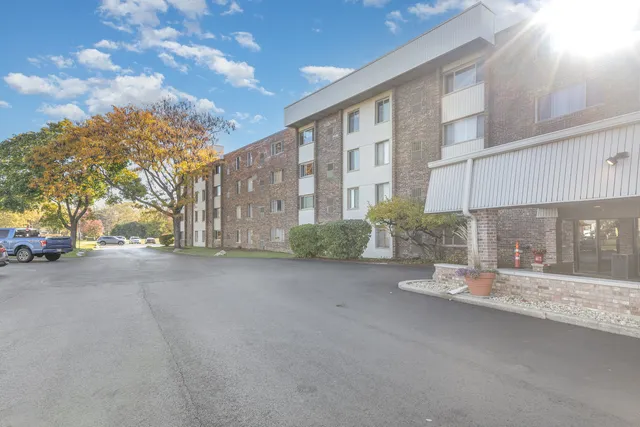 a view of a street with a building in the background