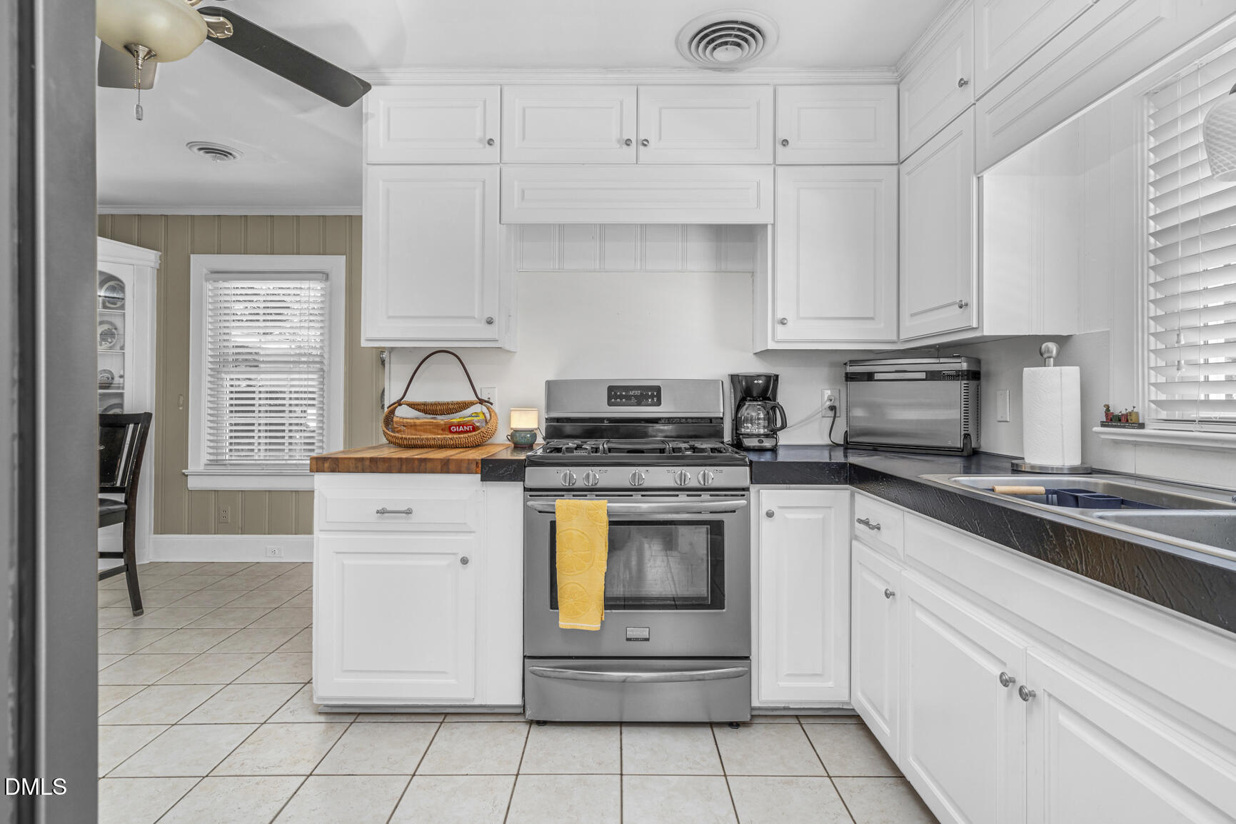 6515 Tonya Road Elm City, NC 27822 - Photo 10 of 52 a kitchen with white cabinets appliances and a window