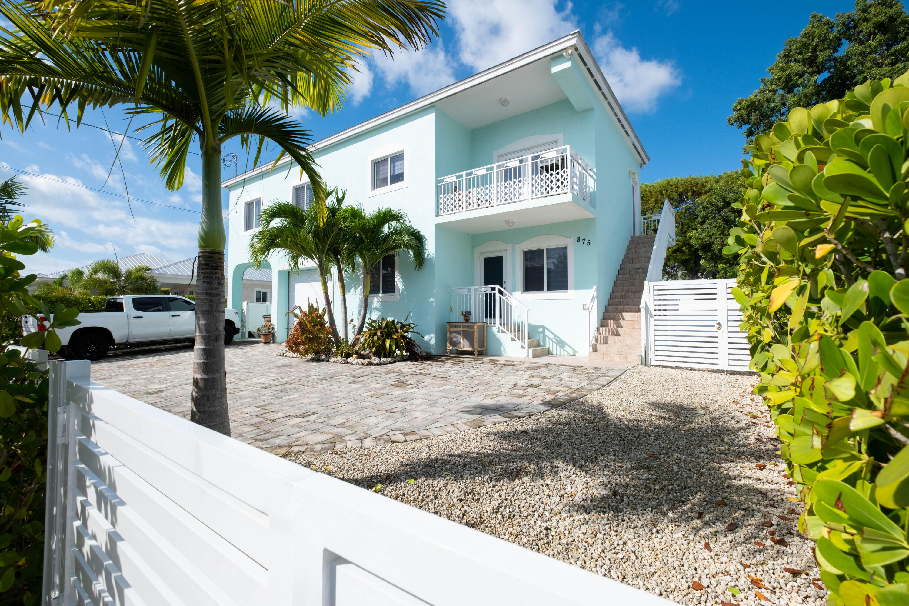 a view of a house with a tree