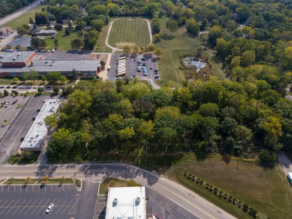an aerial view of a house with a yard