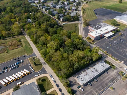 an aerial view of a residential houses with outdoor space