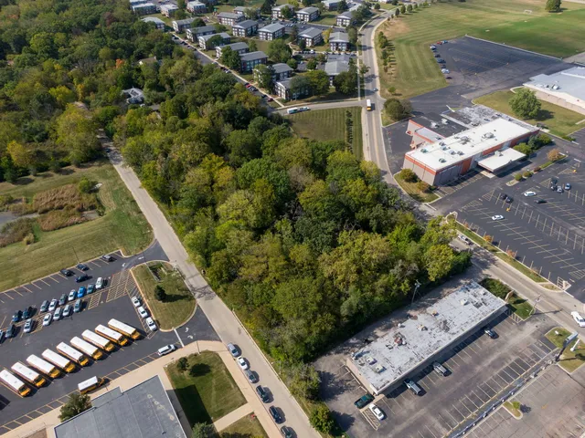 an aerial view of a residential houses with outdoor space
