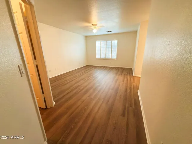 a view of a room with wooden floor and staircase