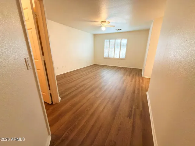 a view of an entryway with wooden floor