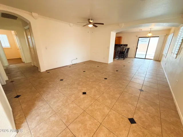a view of a livingroom with a furniture and a ceiling fan