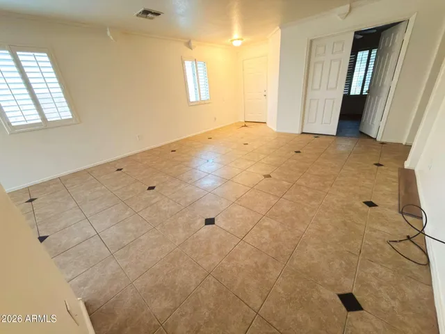 a view of an empty room with windows