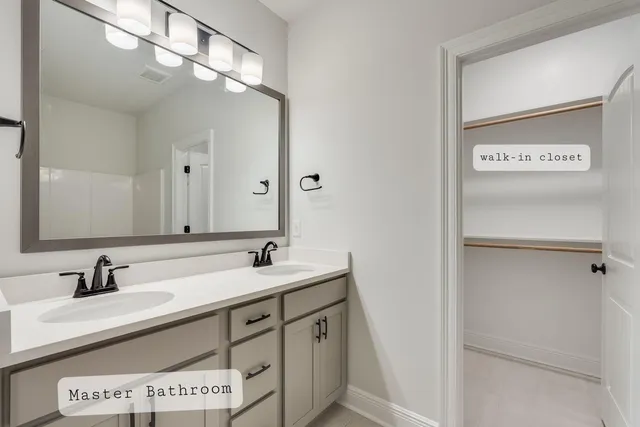 a bathroom with a sink double vanity and a mirror