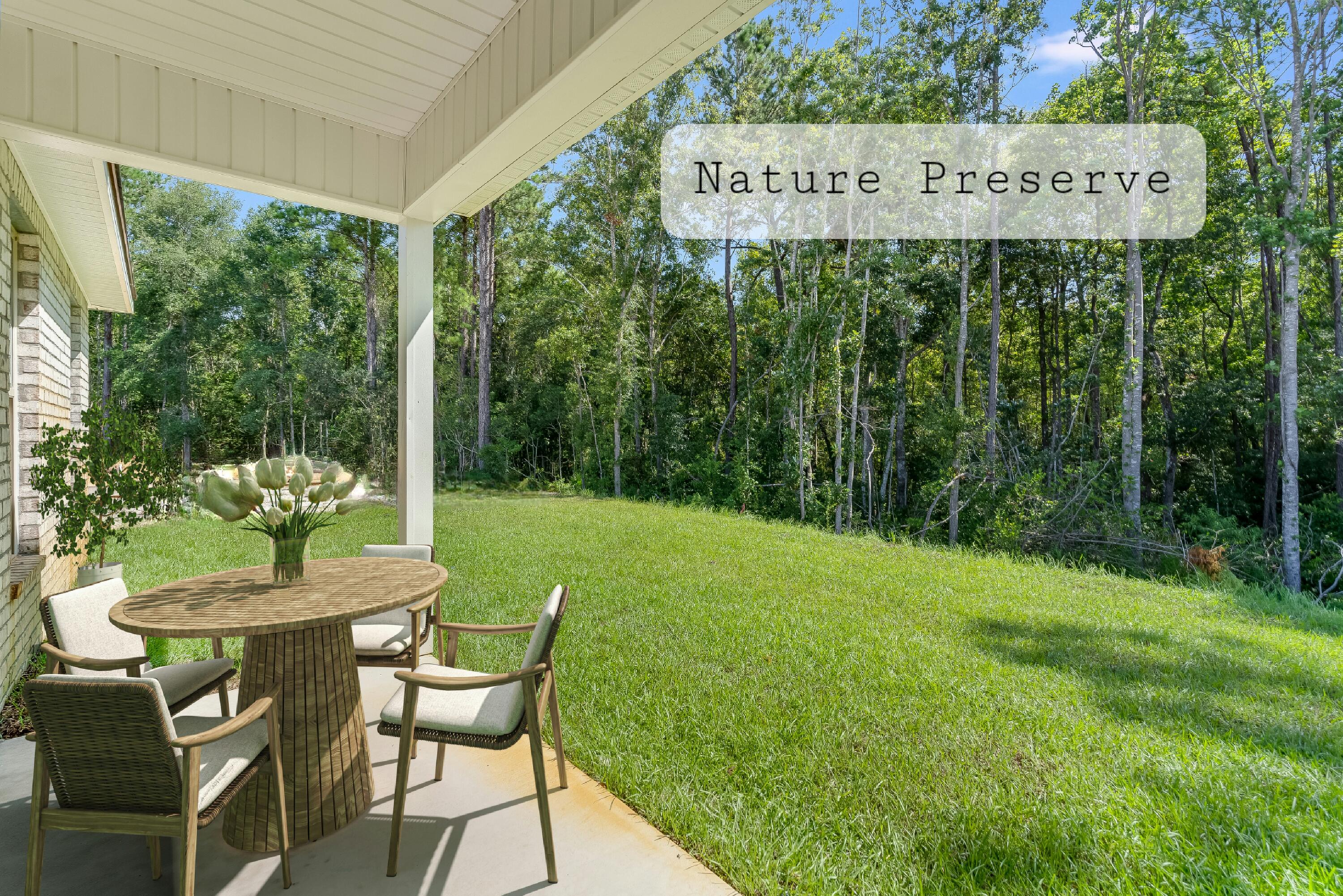 105 Eclipse Loop Freeport, FL 32439 - Photo 17 of 23 a view of a chairs and table in a yard