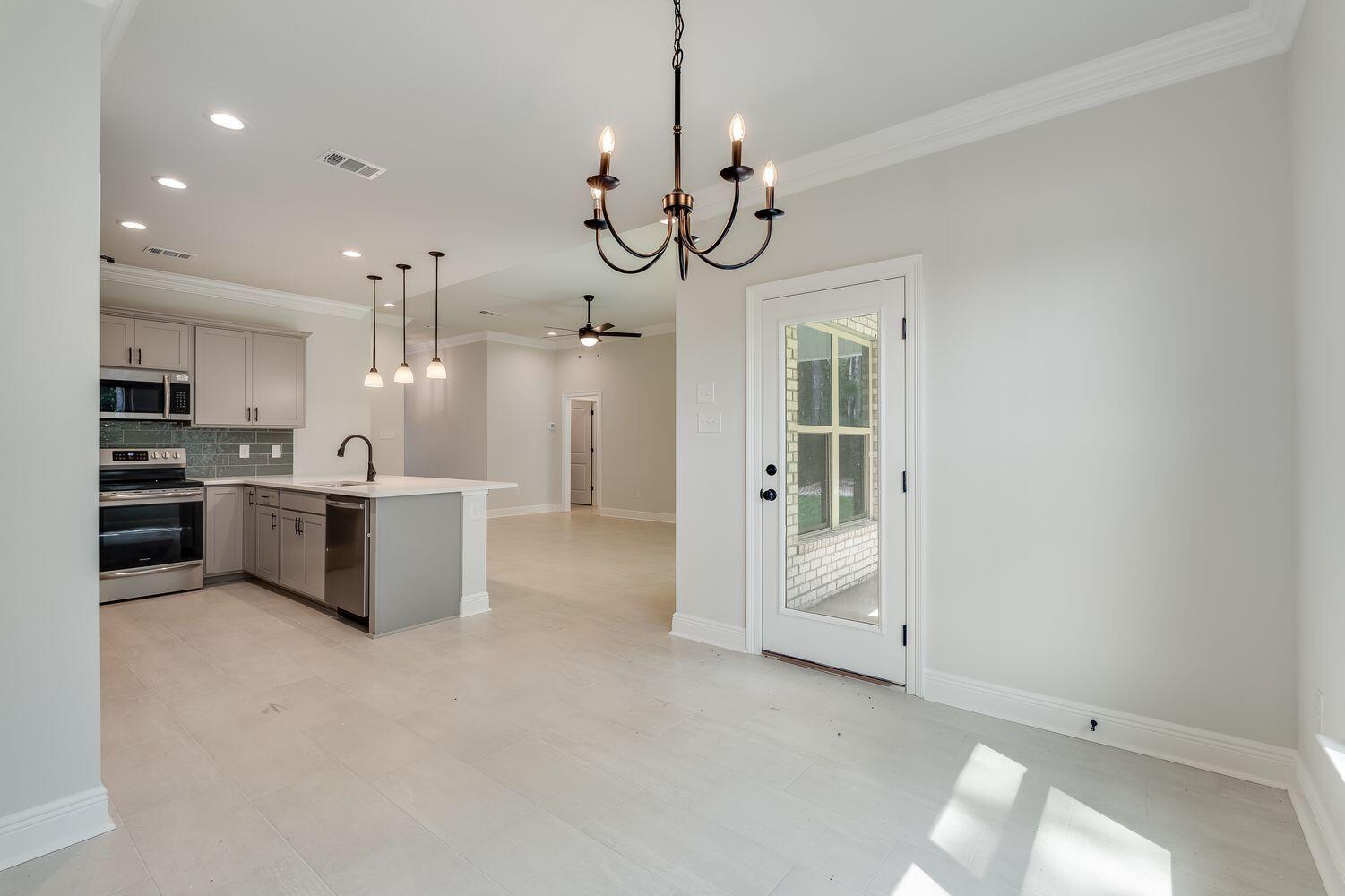 105 Eclipse Loop Freeport, FL 32439 - Photo 8 of 23 a view of a kitchen and a sink