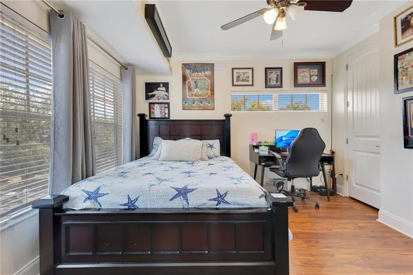 a bed room with a bed and a chair