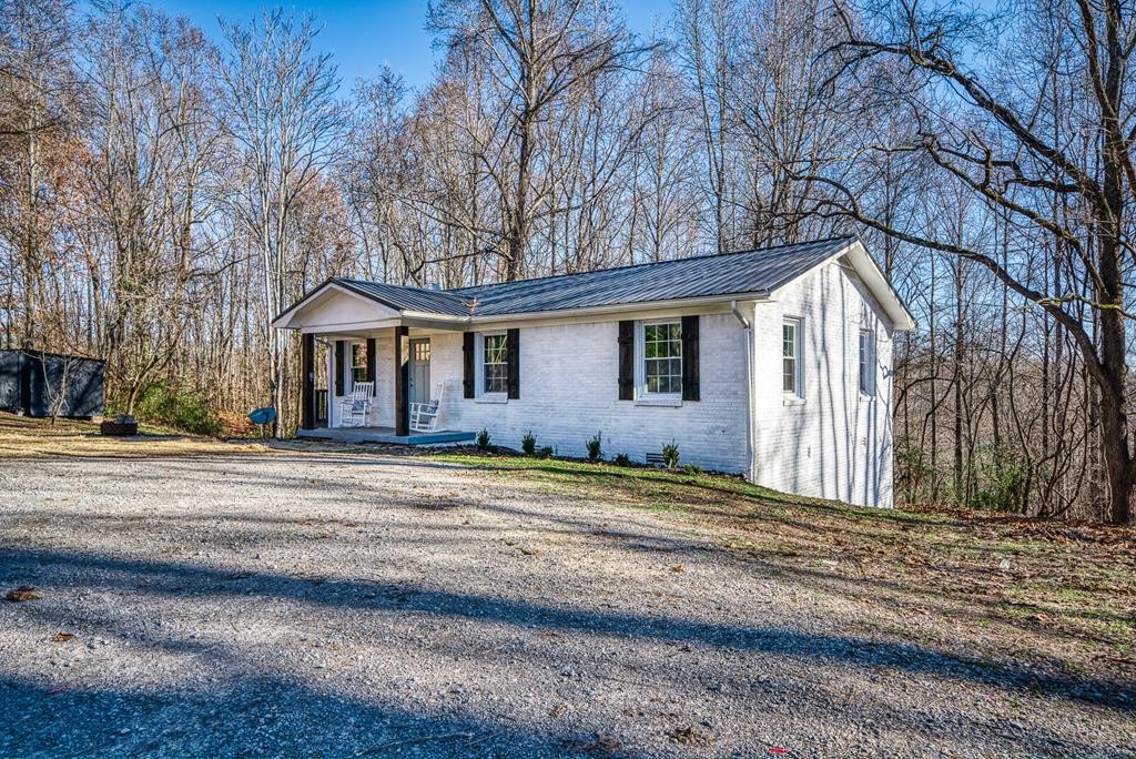 329 Sunny Point Road Baxter, TN 38544 - Photo 23 of 25 a front view of a house with a yard