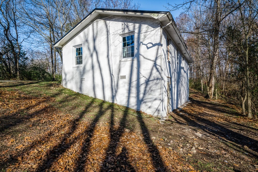 329 Sunny Point Road Baxter, TN 38544 - Photo 4 of 25 a view of a house with a yard