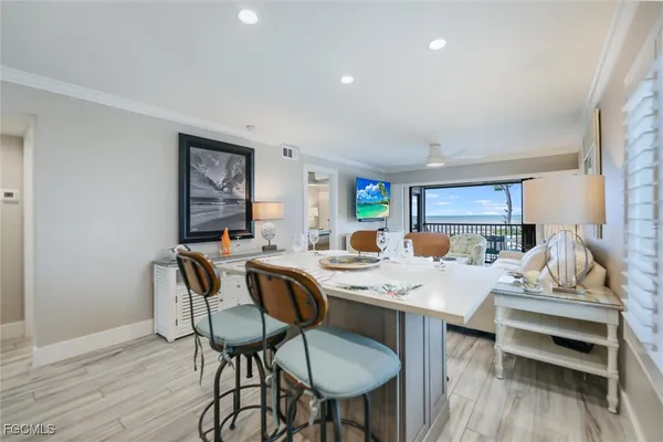 a very nice looking dining room with a table and chairs