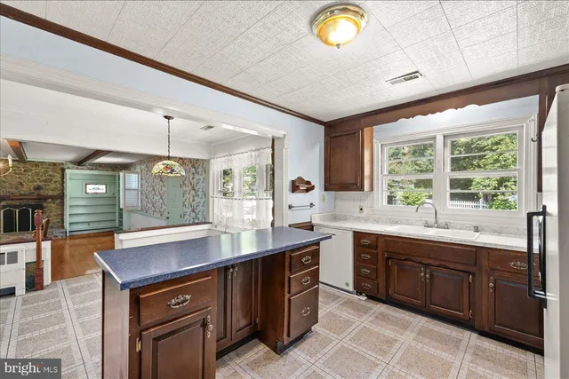 a kitchen with a sink and cabinets