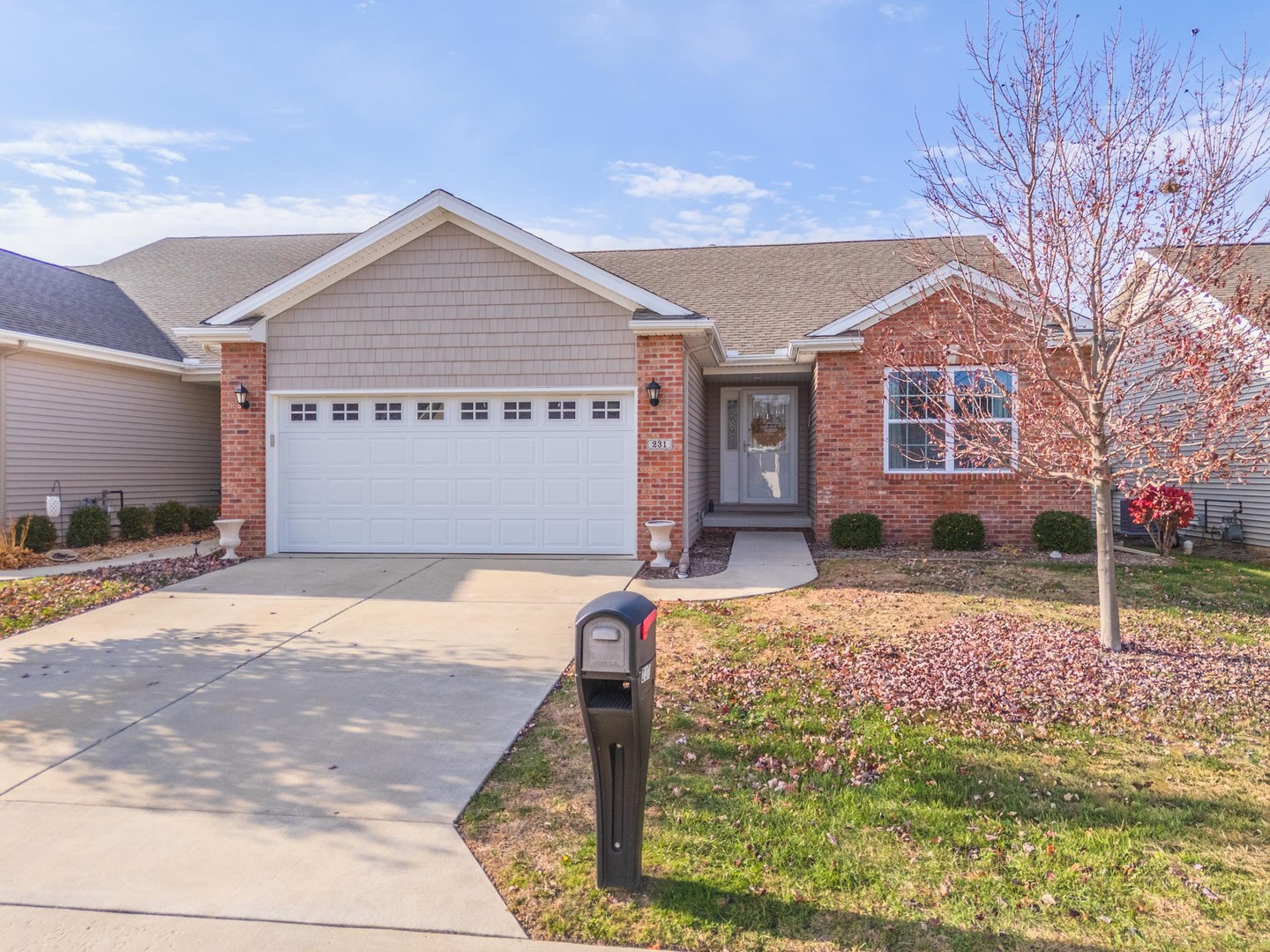 231 Eugene Drive Normal, IL 61761 - Photo 1 of 30 a front view of a house with garden