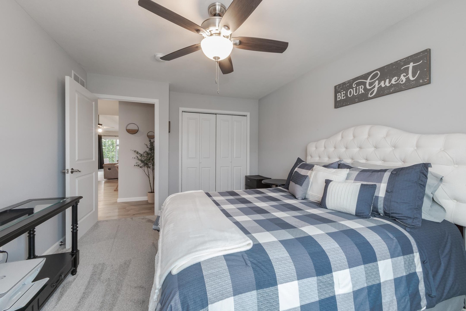 231 Eugene Drive Normal, IL 61761 - Photo 17 of 30 a bedroom with a bed and a chandelier