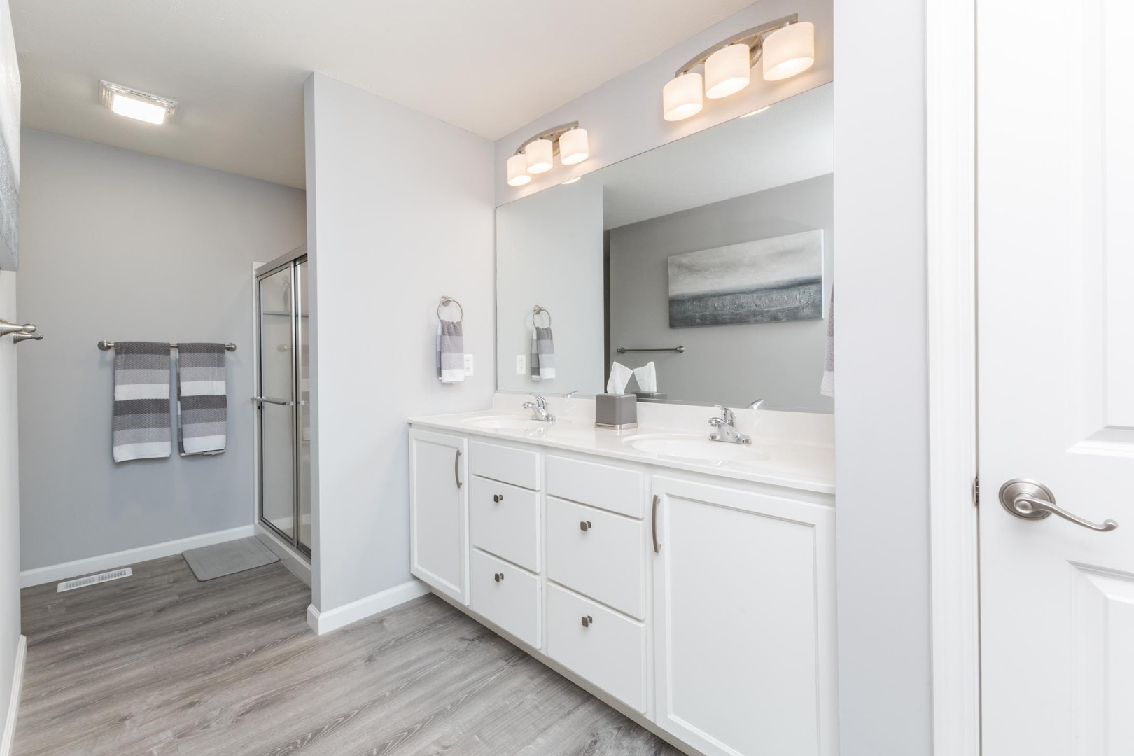 231 Eugene Drive Normal, IL 61761 - Photo 20 of 30 a bathroom with a double vanity sink and mirror