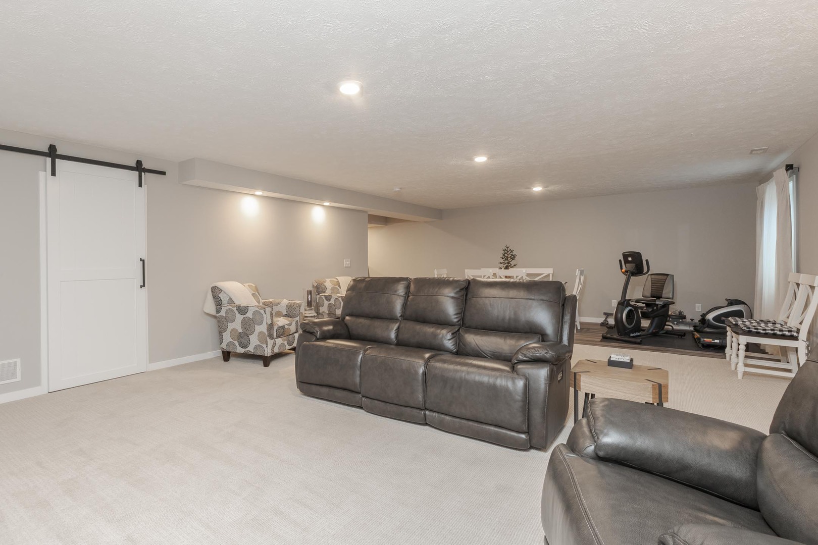 231 Eugene Drive Normal, IL 61761 - Photo 25 of 30 a living room with furniture and a flat screen tv