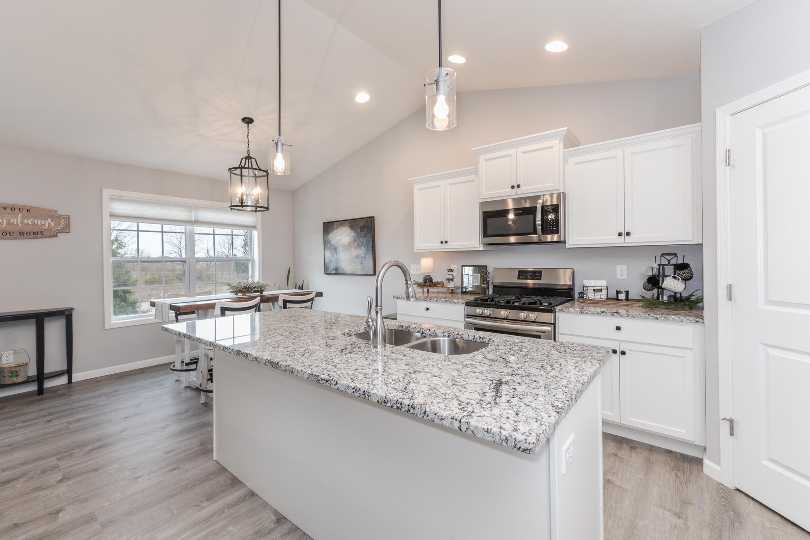 231 Eugene Drive Normal, IL 61761 - Photo 4 of 30 a kitchen with sink stove and microwave