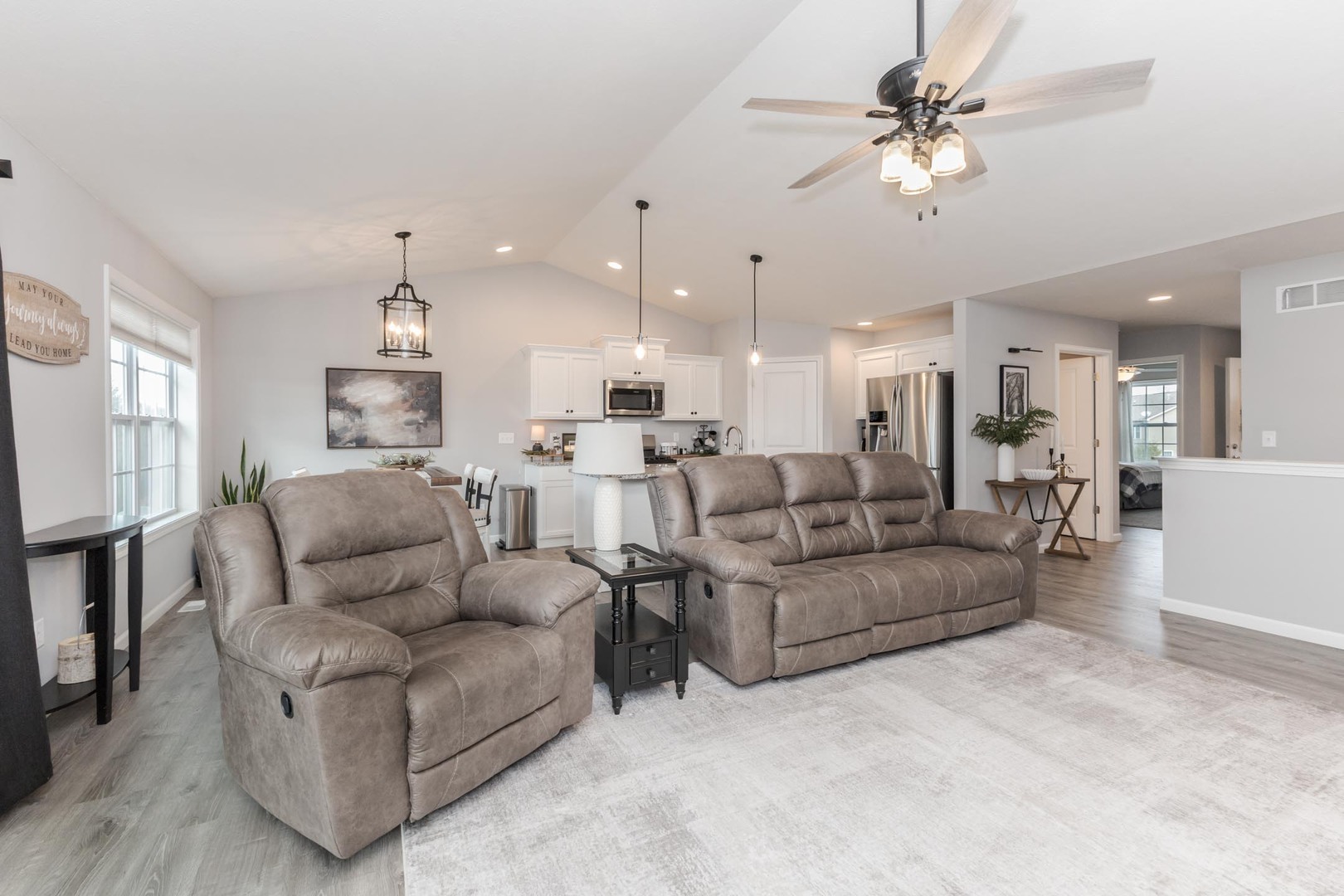 231 Eugene Drive Normal, IL 61761 - Photo 10 of 30 a living room with furniture kitchen view and a chandelier