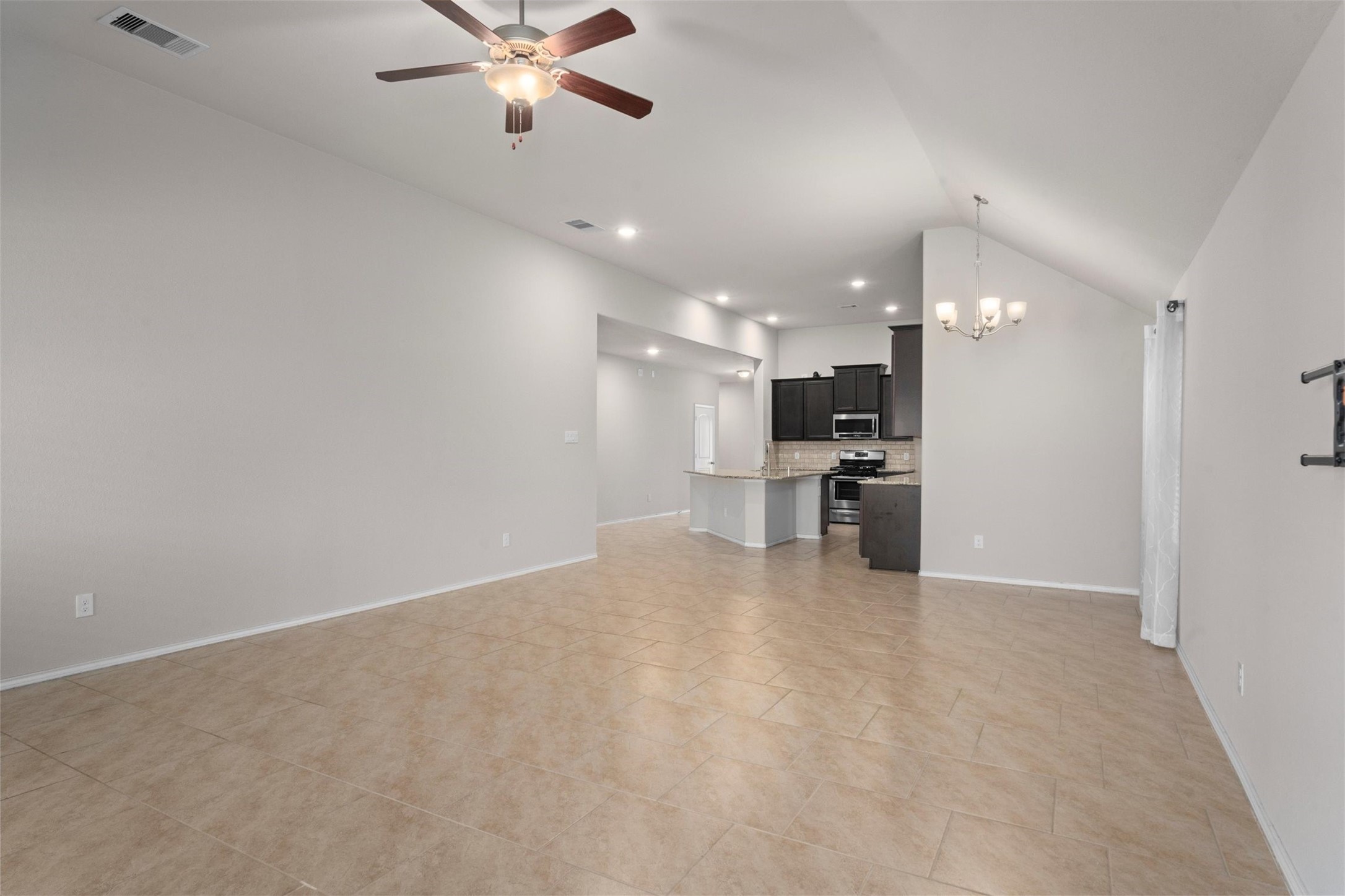 5210 Adria Hills Circle Spring, TX 77389 - Photo 14 of 42 a view of a kitchen with a refrigerator and a sink