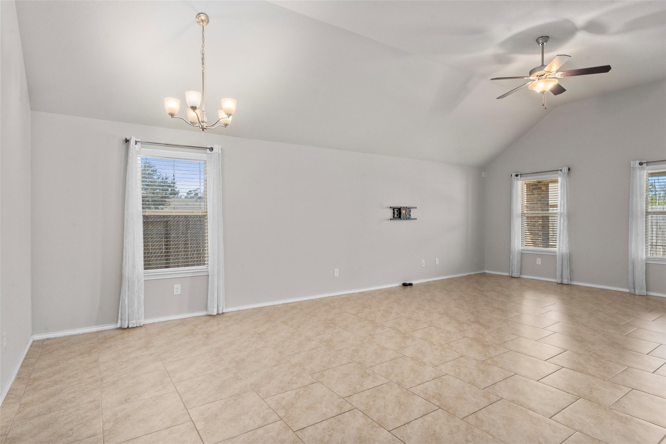 5210 Adria Hills Circle Spring, TX 77389 - Photo 15 of 42 a view of an empty room with a chandelier fan