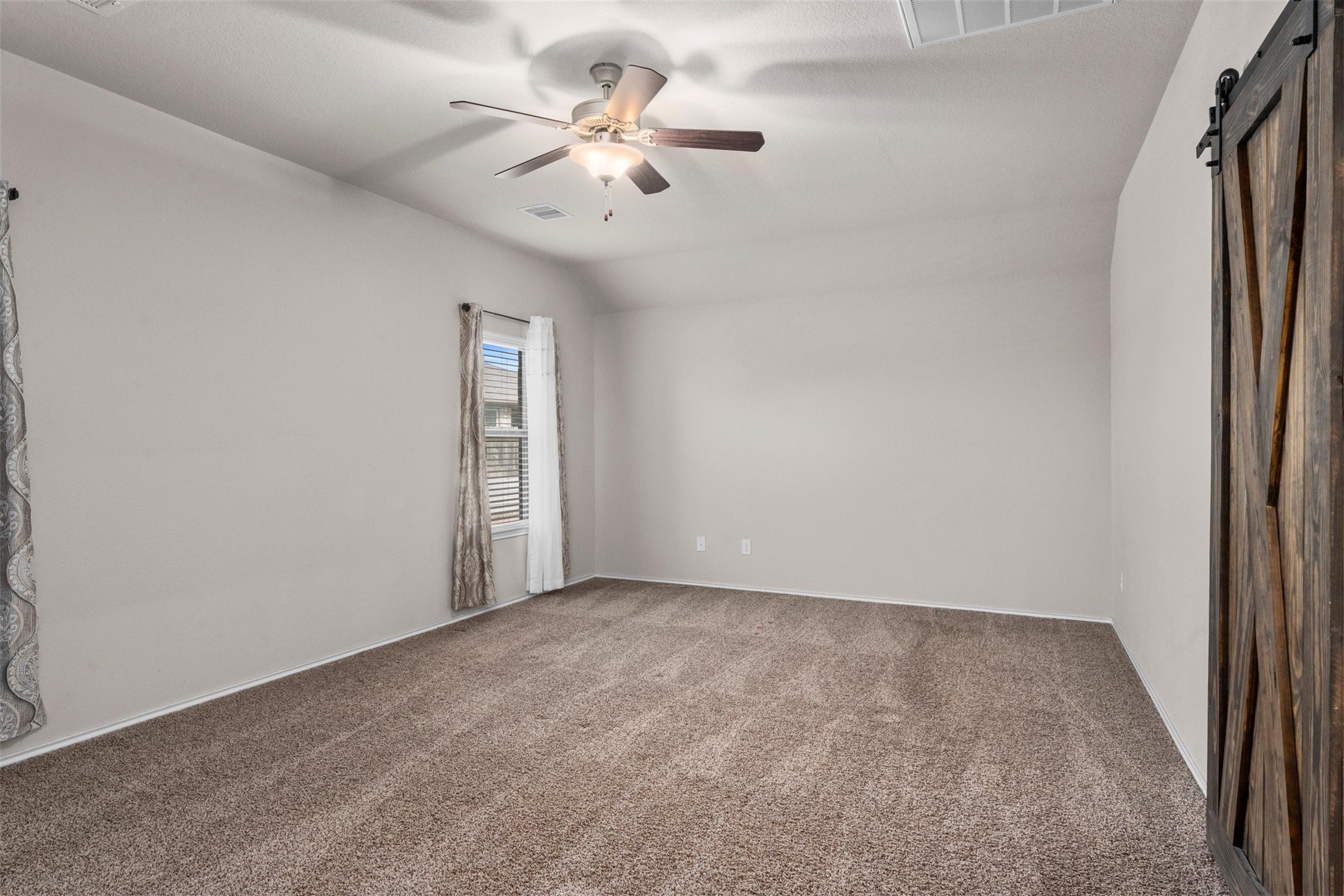 5210 Adria Hills Circle Spring, TX 77389 - Photo 16 of 42 an empty room with windows and fan
