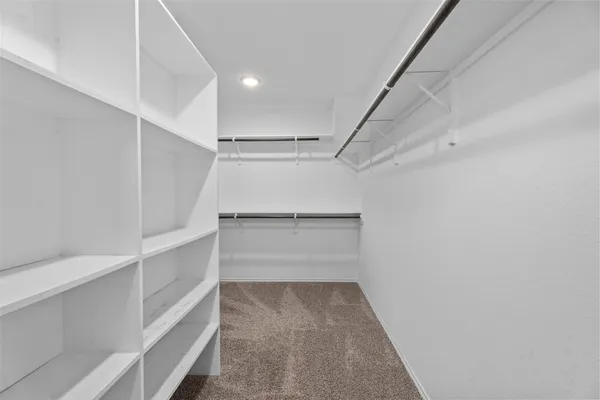 a view of an empty walk in closet