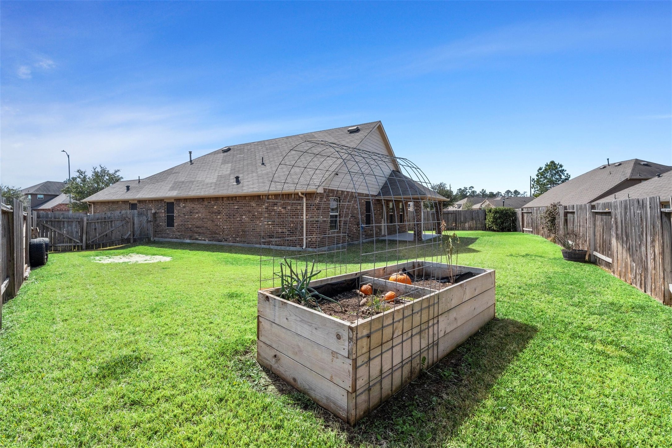 5210 Adria Hills Circle Spring, TX 77389 - Photo 34 of 42 a backyard of a house with table and chairs