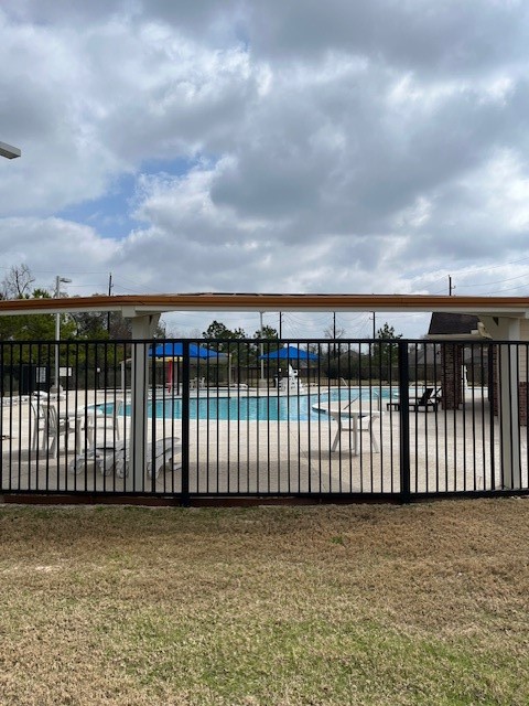 5210 Adria Hills Circle Spring, TX 77389 - Photo 39 of 42 a view of a brick building with wooden fence
