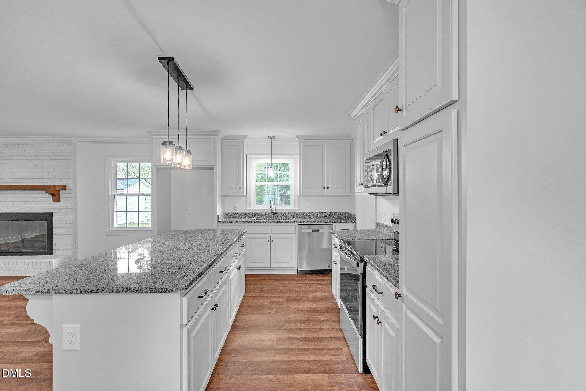 1219 Queen Anne Road Northwest Wilson, NC 27896 - Photo 18 of 26 a large kitchen with granite countertop lots of counter space and window