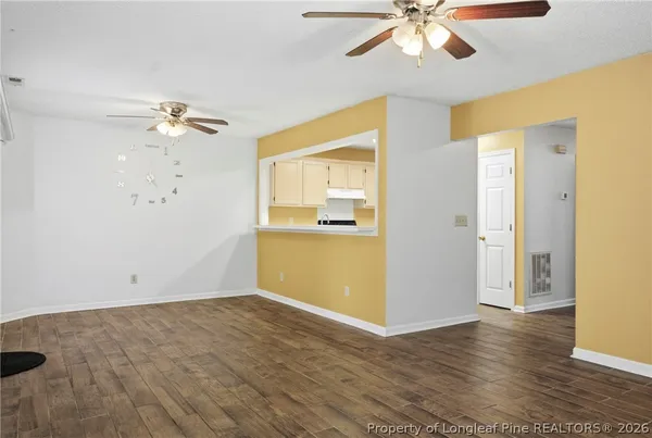 a view of an empty room with a window