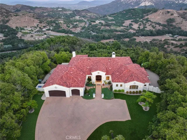 an aerial view of house with yard