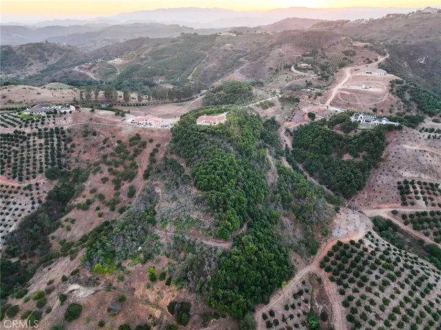 an aerial view of residential house and green space